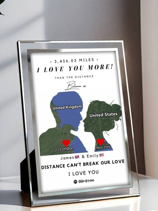 Framed artwork with silhouettes of a man and woman kissing, labeled 'United Kingdom' and 'United States', with text about distance and love.
